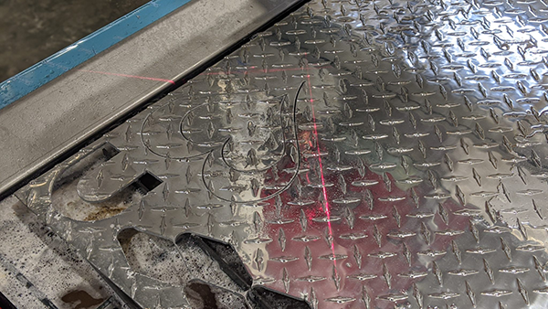 Mark Obannon a plumber in Nantucket using his new Swift-Cut Pro CNC plasma metal cutting table to cut out shape from a metal sheet