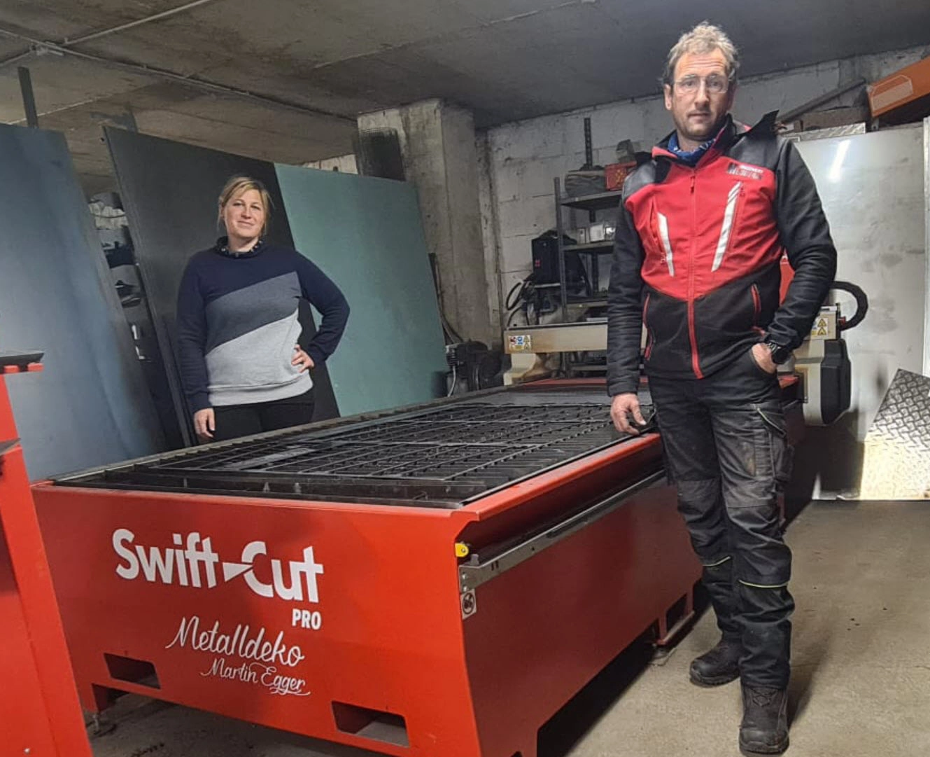 Martin and Verena Egger Metalldeko, a metal decoration production company standing in front of their Swift-Cut Pro CNC Plasma metal cuttting Table