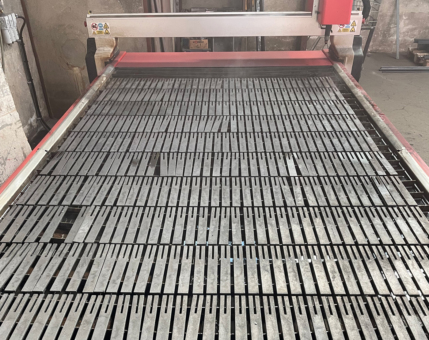 Schlosserei Bierbaumer's Swift-Cut Pro Table showing cut metal pieces