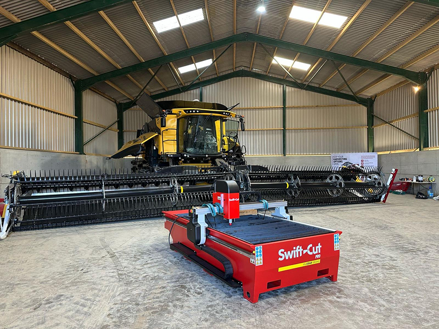 Swift-Cut Pro Table in front of YouTuber Tom Lambs farm machinery