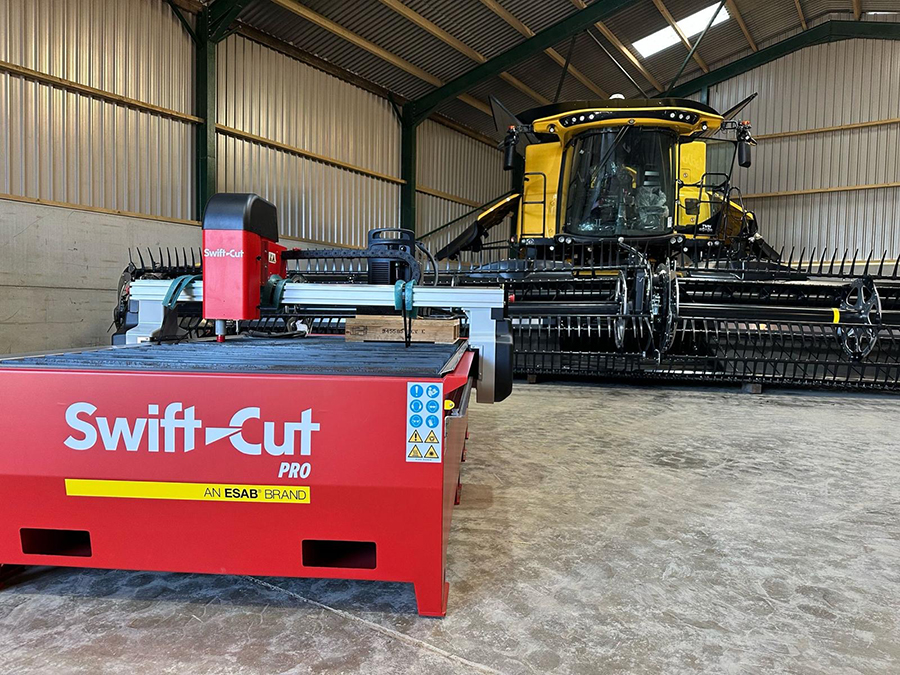 Swift-Cut Pro Table in front of YouTuber Tom Lambs farm machinery