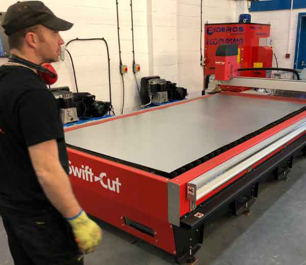Swift-Cut HVAC Pro CNC plasma cutting table in workshop with operator