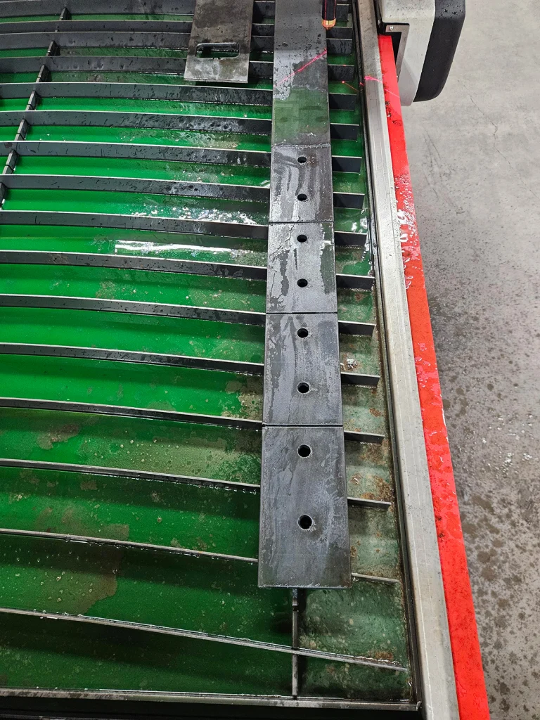 Dakota Steel & Fabrication new Swift-Cut Pro 510 view from above table with cut out metal pieces