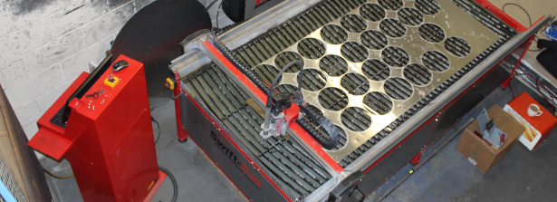 Glanville Metal Spinning - various cut out metal circular pieces on Swift-Cut Pro CNC plasma cutting table