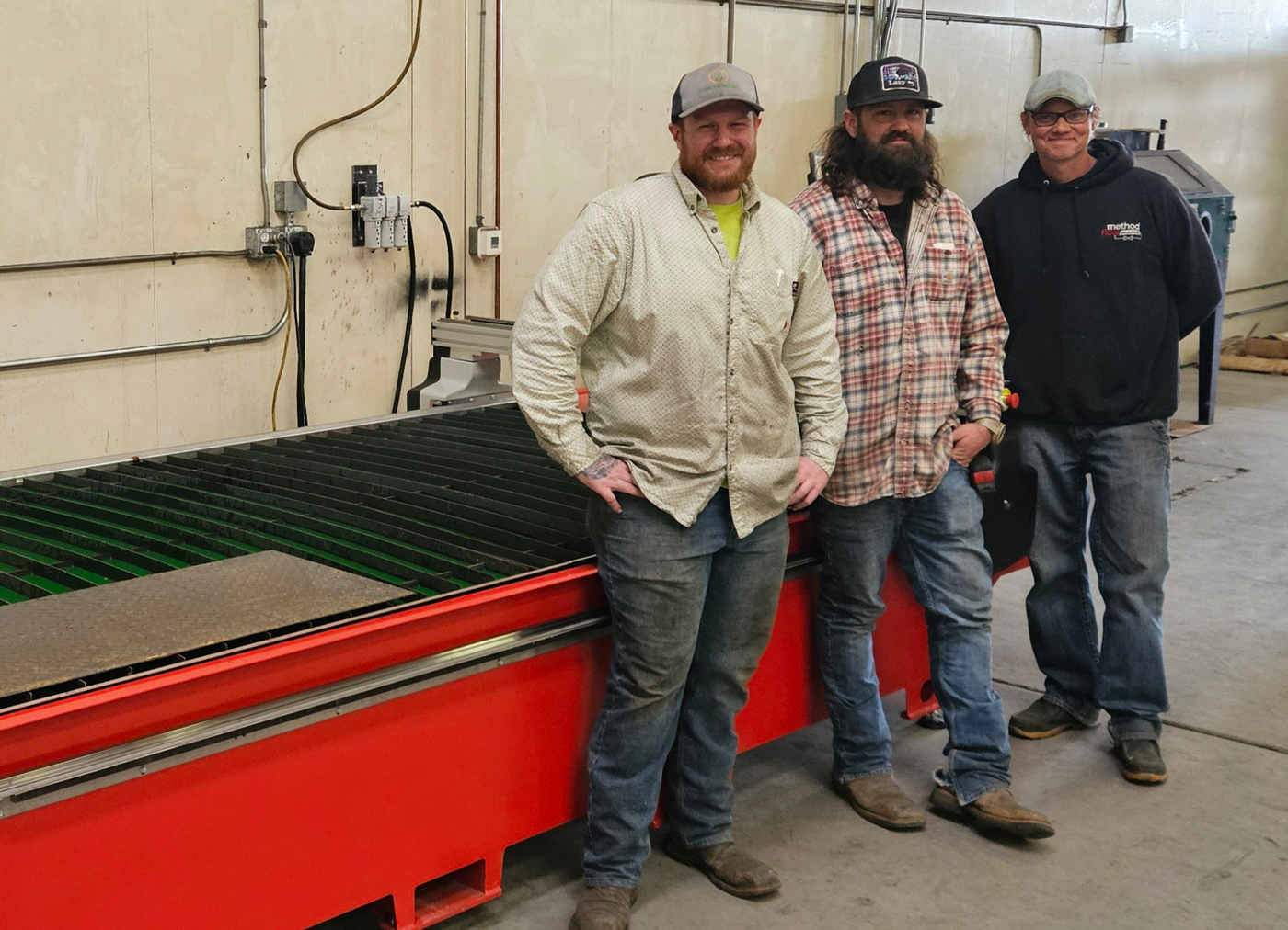Method Flow Products boosts production - Method Flow Metal Cutters standing in front of their excellent new Swift-Cut Pro 510