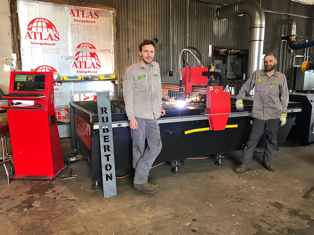 ML Ruberton Construction standing with their Swift-Cut XP CNC plasma metal cutting table in their workshop in New Jersey, USA