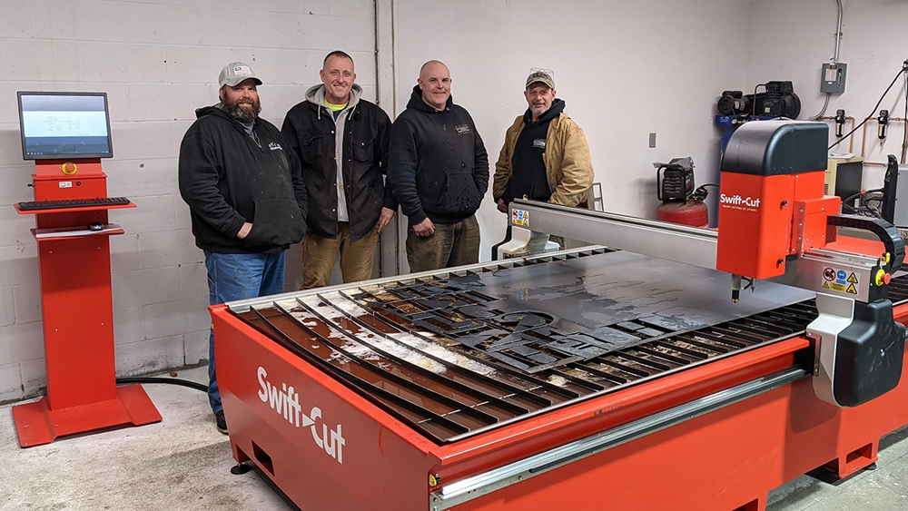 LLIW Cutters standing in front of their excellent Swift-Cut Pro CNC plasma cutting table